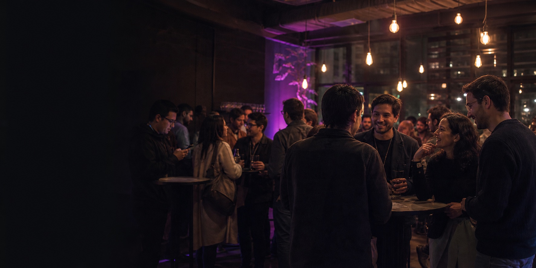 Builders talking together as an evening technology event winds down